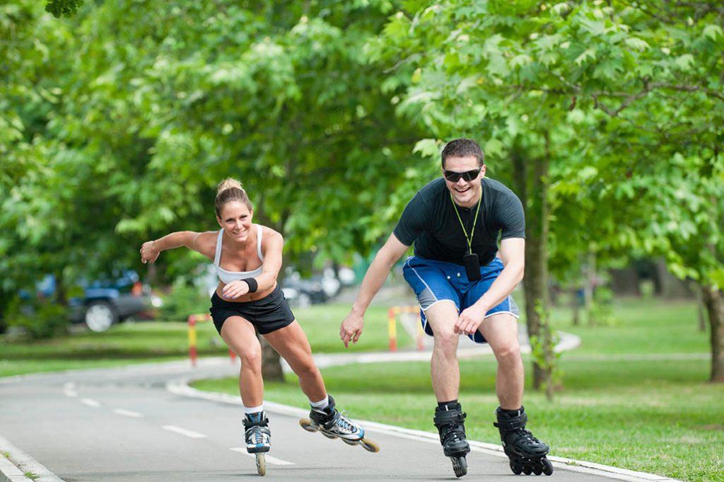 couple rollerblading outdoors