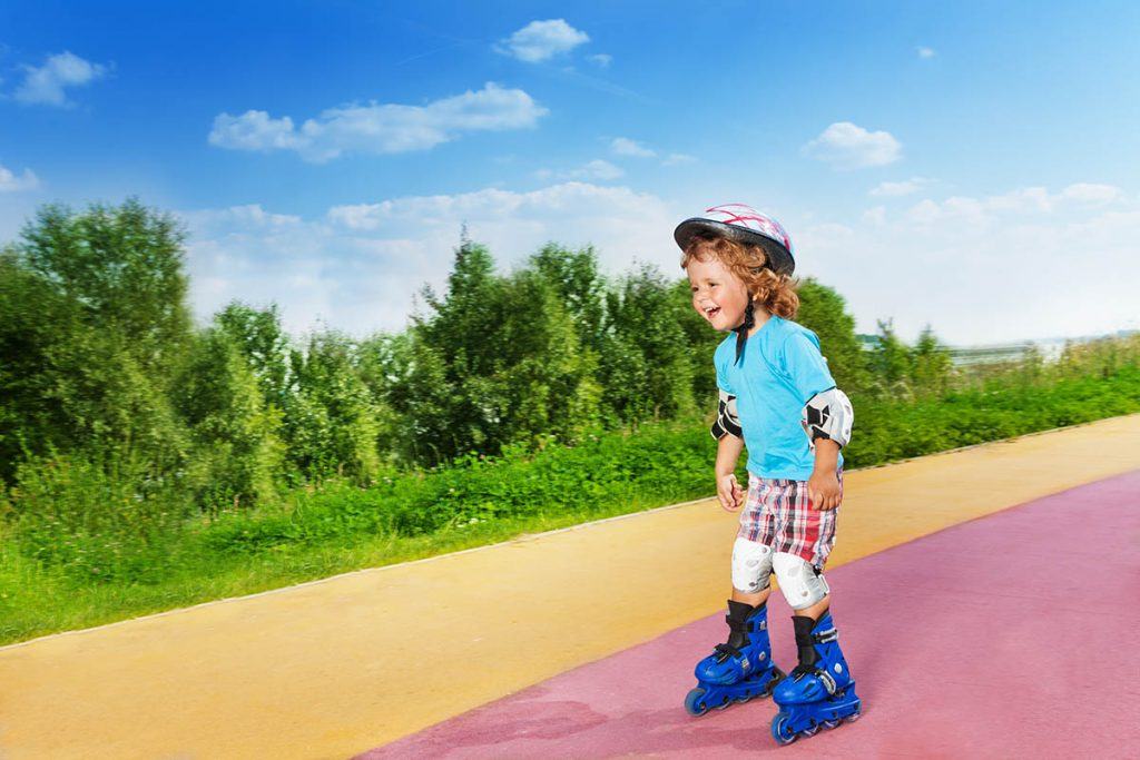 toddler roller skating downhill