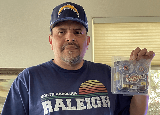 Photo of Ray Lopez holding his 1 of his 2 Volcanic Dazzle roller skate wheel packages.