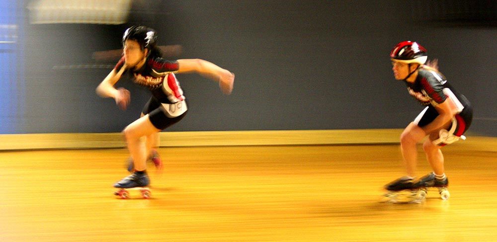 2 ladies quad speed skating in their best speed skate wheels